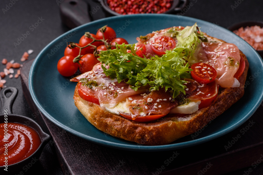 Ciabata with jamon or prosciutto, tomatoes, cheese and lettuce Ciabata with jamon or prosciutto, tomatoes, cheese and lettuce