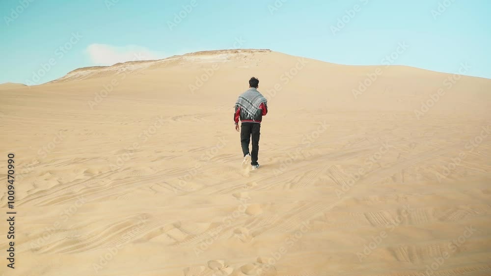 A tourist walks alone, exploring the landmarks of Siwa Oasis wearing a jacket in winter, where the clear blue sky and bright sun A tourist walks alone, exploring the landmarks of Siwa Oasis wearing a jacket in winter, where the clear blue sky and bright sun