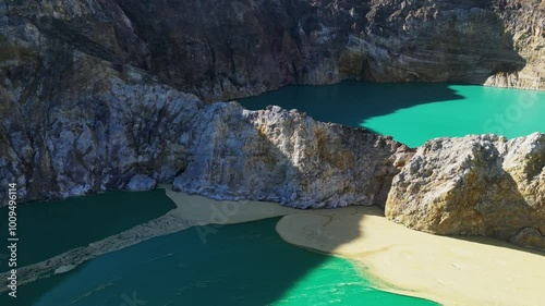 Aerial view of volcano Kelimutu with tricolored lakes in Flores