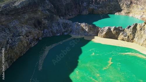 Aerial view of volcano Kelimutu with tricolored lakes in Flores