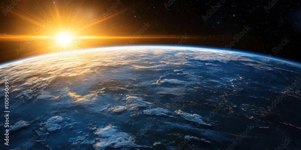 A stunning sunrise over Earth as seen from space, with the sun's rays illuminating the atmosphere. A stunning sunrise over Earth as seen from space, with the sun's rays illuminating the atmosphere.