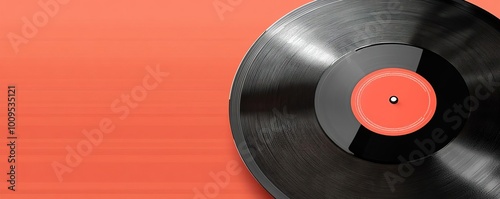 A close-up of a vintage vinyl record on a colorful orange background, perfect for music and retro-themed projects.