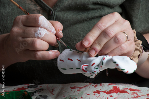 The hands of a craftswoman elaborating a traditional and ancestral figure of clay craftsmanship in Mallorca (Spain) called 