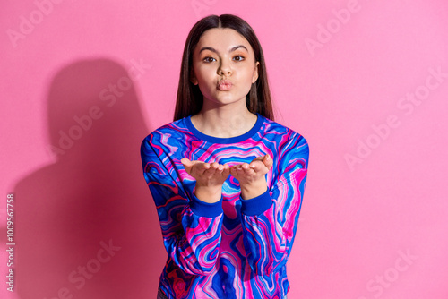 Photo portrait of attractive teen woman send air kiss dressed stylish colorful clothes isolated on pink color background