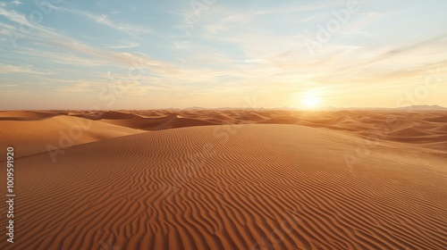 A vast desert landscape at sunset, showcasing rolling sand dunes beneath a colorful sky.