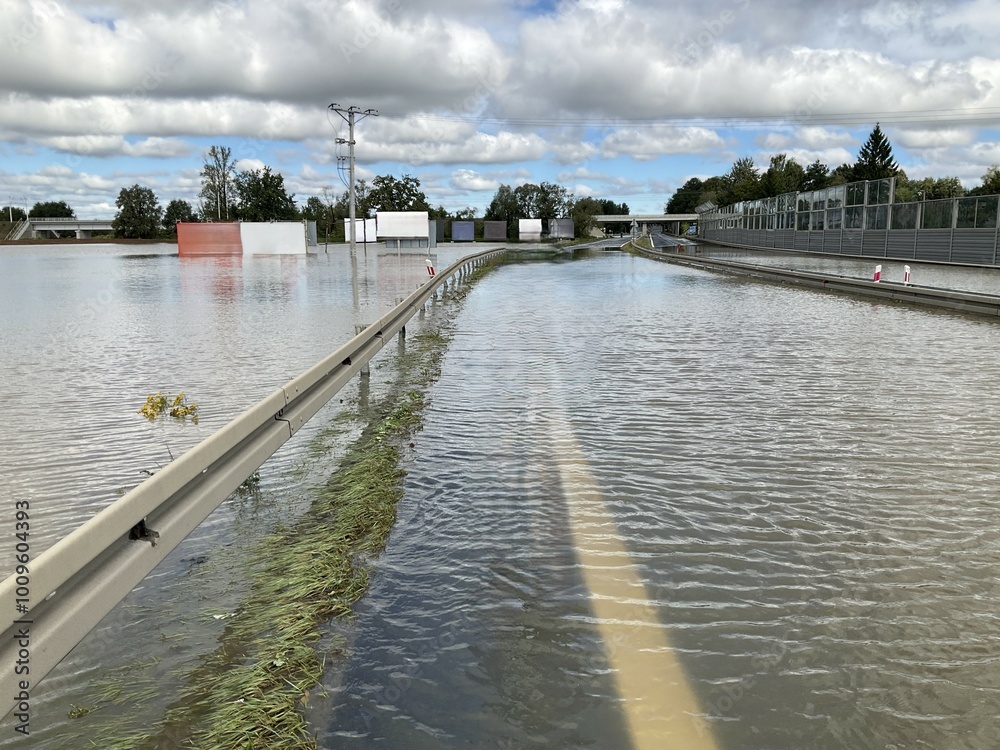 Flooded and impassable national road DK1 due to pool of water at confluence of Rivers Wapienica and Iłownica during flood in September 2024 in Poland in Czechowice Dziedzice. Topic: river alert status Flooded and impassable national road DK1 due to pool of water at confluence of Rivers Wapienica and Iłownica during flood in September 2024 in Poland in Czechowice Dziedzice. Topic: river alert status