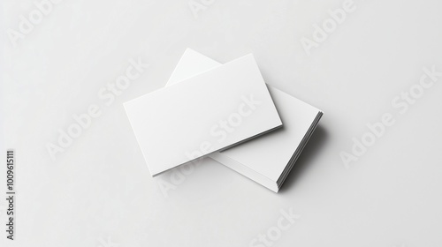 Blank business cards stacked on white background