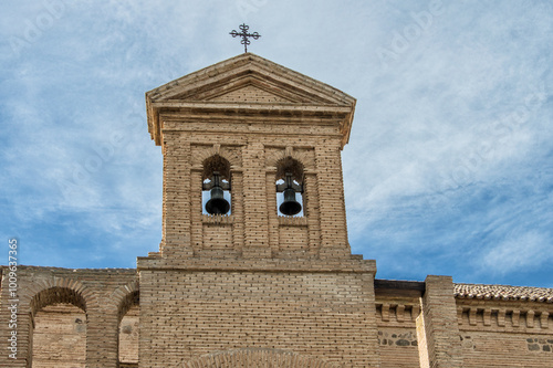 Brick bulrush with two bells of a church in Toledo. Spain photo