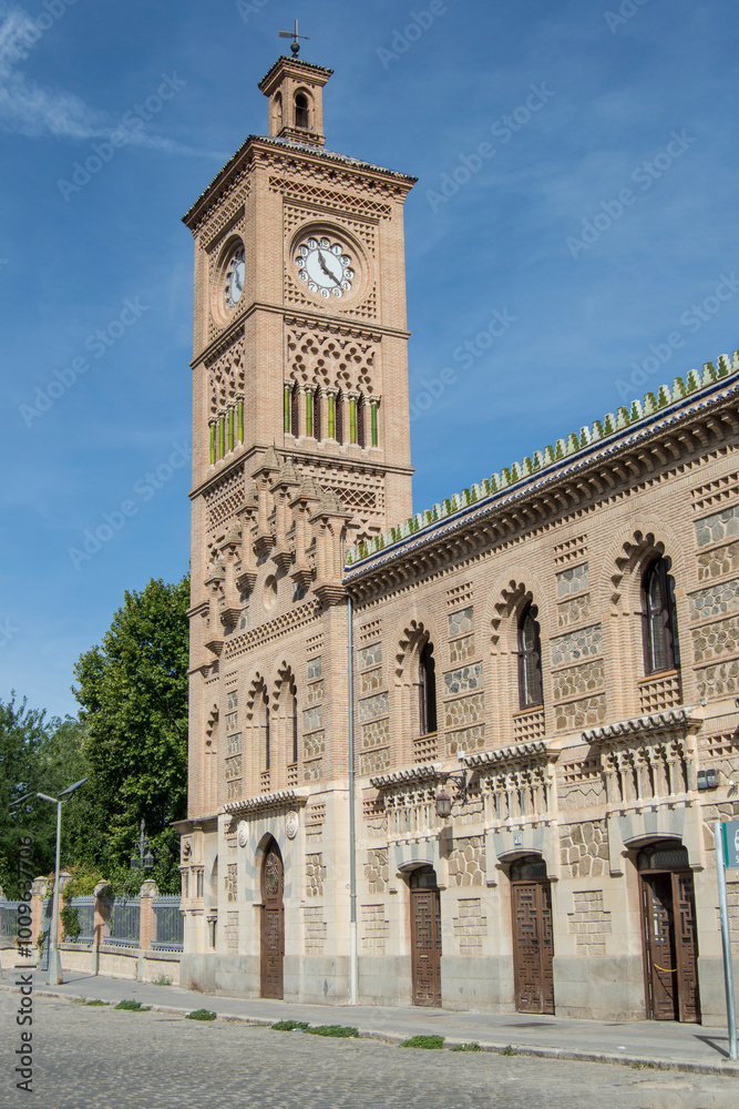 Clock tower and neo-Mudejar brick exterior facade of the Toledo train station. Spain Clock tower and neo-Mudejar brick exterior facade of the Toledo train station. Spain