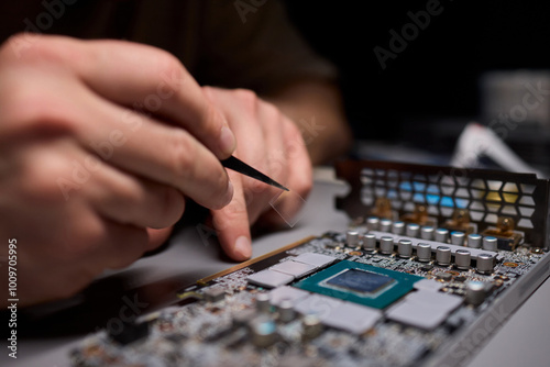 Hand Repairing a Graphics Card through the Application of Thermal Paste for Better Performance