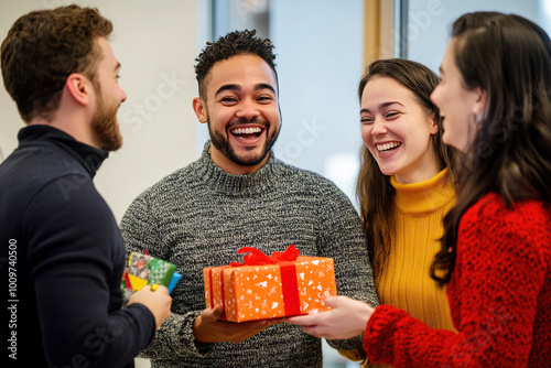 A diverse group of office workers laughing and enjoying a Secret Santa gift exchange.