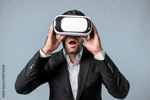 Close up of smart project manager looking financial graph hologram from VR glass. Professional business man surprised while checking financial plan from virtual reality world and metaworld. Deviation.