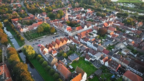 View of the Marktplatz and Remonstrants Church in Friedrichstadt, charming Dutch-style town in Schleswig-Holstein with romantic canals along the Eider and Treene rivers and framed by gabled houses.