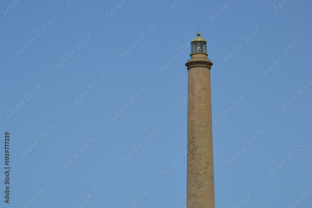 The Maspalomas Lighthouse (spanish: Faro de Maspalomas) located next to Maspalomas beach and sand dunes. Gran Canaria, Spain The Maspalomas Lighthouse (spanish: Faro de Maspalomas) located next to Maspalomas beach and sand dunes. Gran Canaria, Spain