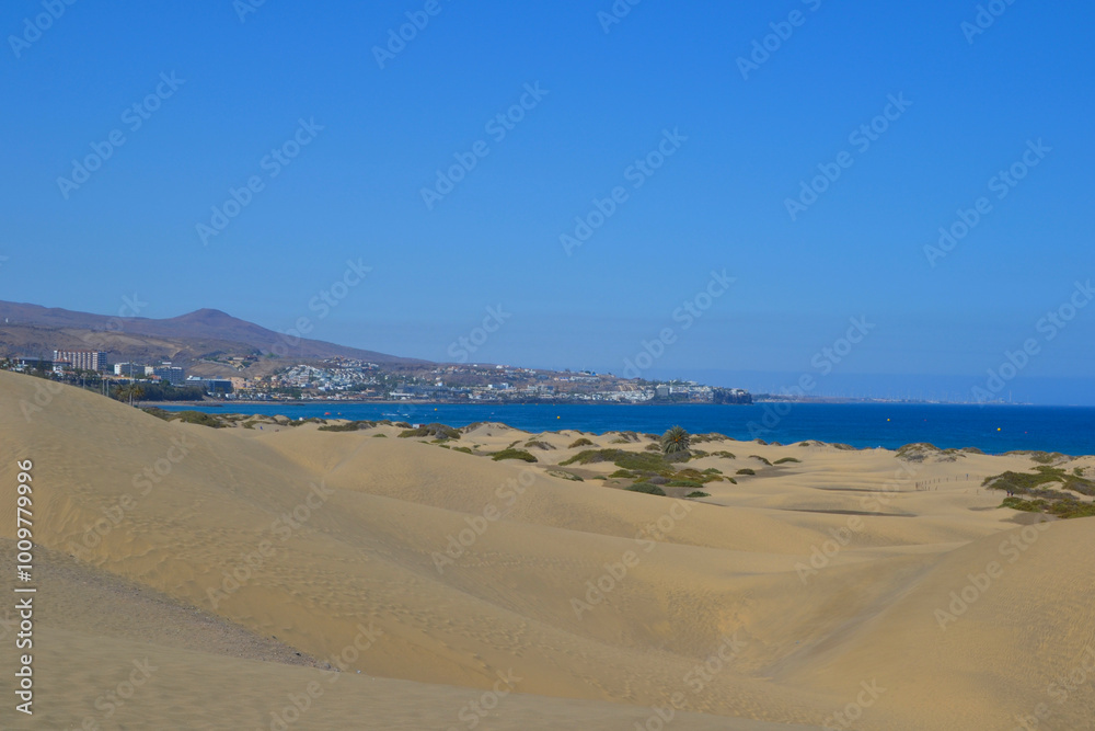 The Maspalomas Dunes (spanish: Dunas de Maspalomas). Sand dunes located on the south coast of the island of Gran Canaria, Spain The Maspalomas Dunes (spanish: Dunas de Maspalomas). Sand dunes located on the south coast of the island of Gran Canaria, Spain