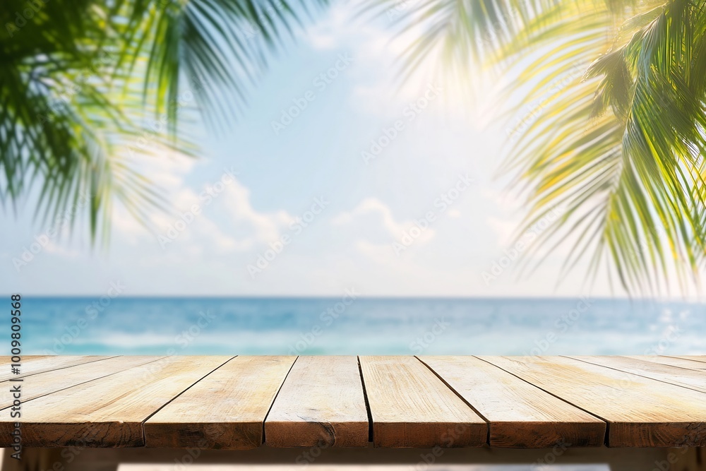 A serene beach view with wooden table and palm leaves framing the scene. A serene beach view with wooden table and palm leaves framing the scene.