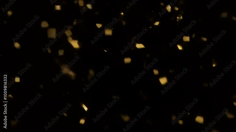 Enigmatic Golden Glittering Particles Floating in Dark Ambiance for Elegant Backgrounds. Golden confetti soaring on a dark background Enigmatic Golden Glittering Particles Floating in Dark Ambiance for Elegant Backgrounds. Golden confetti soaring on a dark background