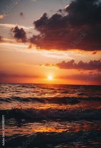 The warm glow of the setting sun casts golden hues over the tranquil waves of the ocean, creating a serene atmosphere by the shoreline during dusk. Sunset or sunrise at sea. Romantic landscape. AI