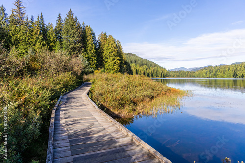 Scenic View of Rolley Lake in Mission, BC, Canada with Wooden Pathway and Lush Forest