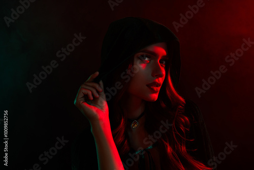 Photo of dangerous evil warlock woman touch cape look feel teasing isolated dark red neon mist color background