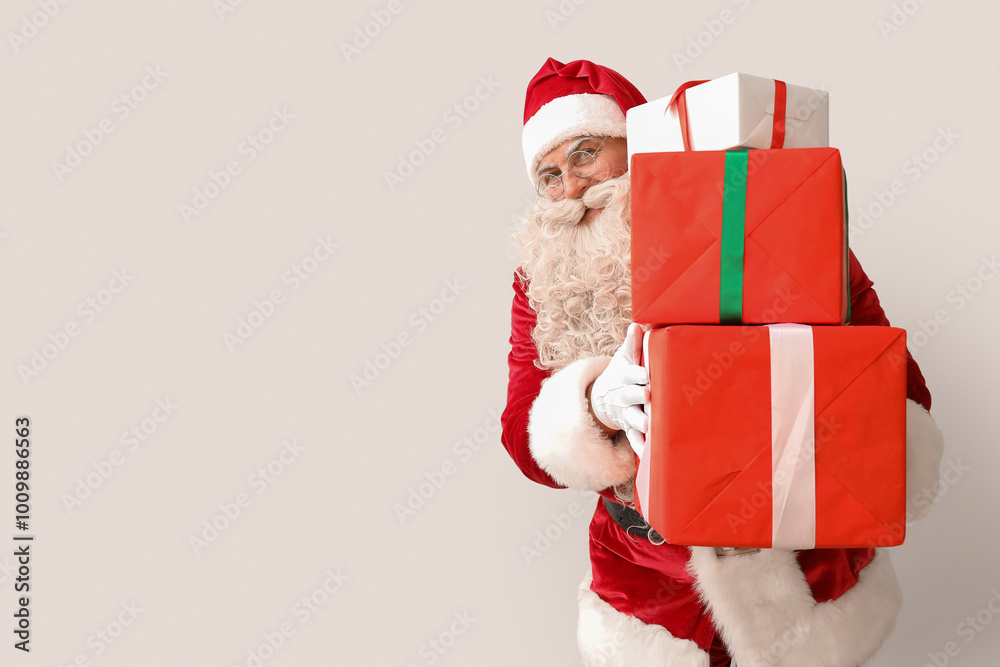 Santa Claus with Christmas gifts on white background Santa Claus with Christmas gifts on white background