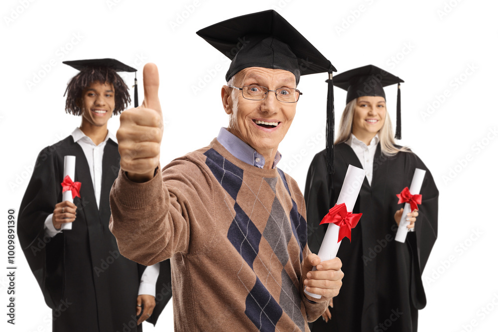 Senior man with graduate students in gowns holding a diploma and gesturing thumbs up Senior man with graduate students in gowns holding a diploma and gesturing thumbs up