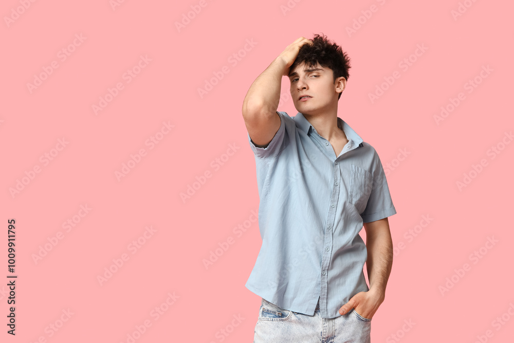 Handsome young man in stylish clothes on pink background Handsome young man in stylish clothes on pink background