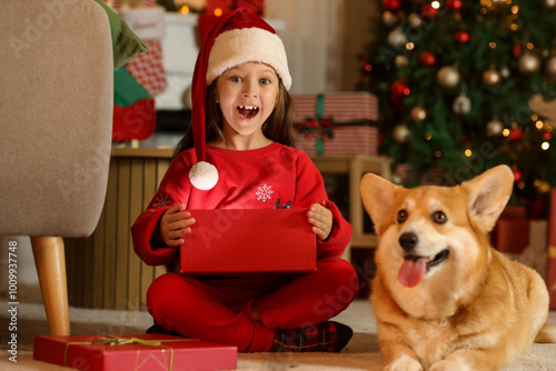 Cute shocked girl in Santa ...