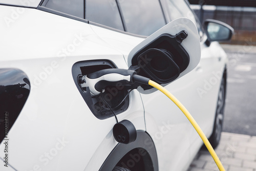 The electric car charger plugged in to the socket, the modern electric car charging