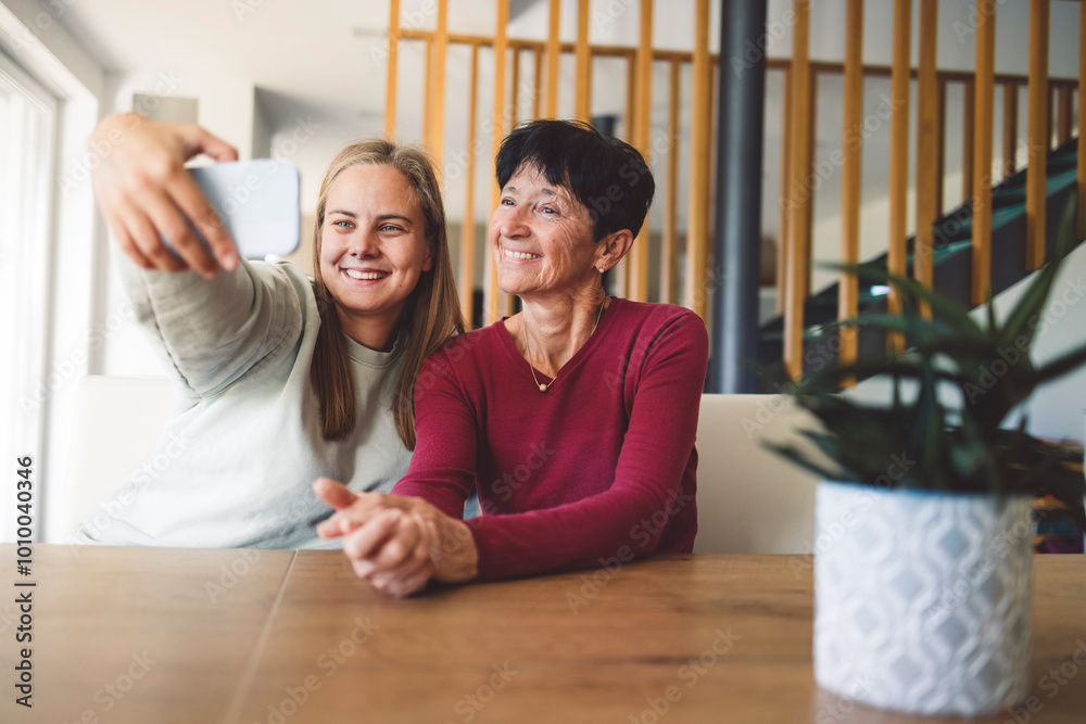 Walking together, coming from store, putting on jackets, carrying bags. Granddaughter taking selfie with her grandma at her house in dining area. Walking together, coming from store, putting on jackets, carrying bags. Granddaughter taking selfie with her grandma at her house in dining area.