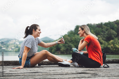 Friends enjoying a day at the lake. Best friends spending their free time by the lake. #1010058535