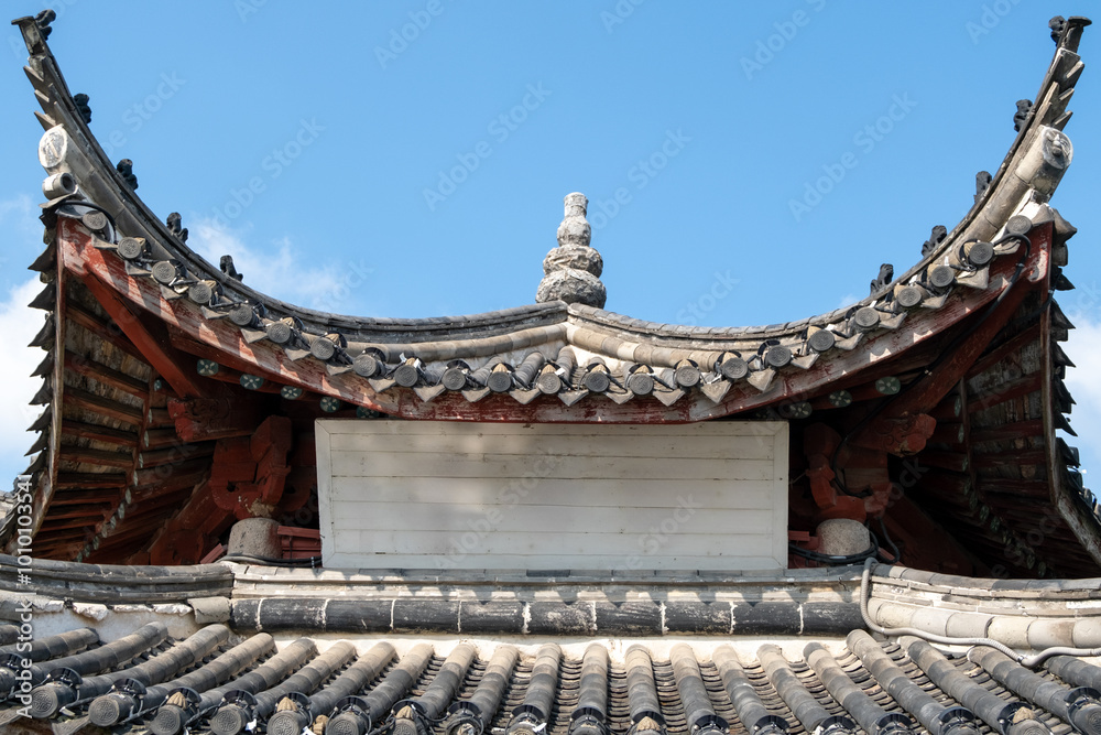 Background texture of a blank and empty sign board on a traditional Chinese temple roof, showcases ornate curved eaves, intricate tilework, and wooden beams. Copy space for design. Background texture of a blank and empty sign board on a traditional Chinese temple roof, showcases ornate curved eaves, intricate tilework, and wooden beams. Copy space for design.