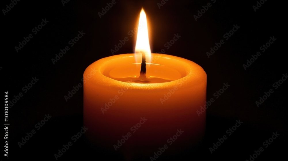 Warm Glow of a Single Flame Candle in Darkness Warm Glow of a Single Flame Candle in Darkness