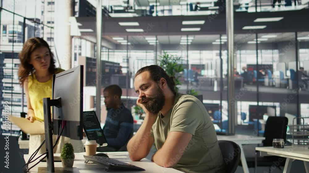 Fatigued software engineer caught asleep at desk by manager while developing artificial intelligence tech. Team leader waking up lazy worker while training predictive models, camera B Fatigued software engineer caught asleep at desk by manager while developing artificial intelligence tech. Team leader waking up lazy worker while training predictive models, camera B