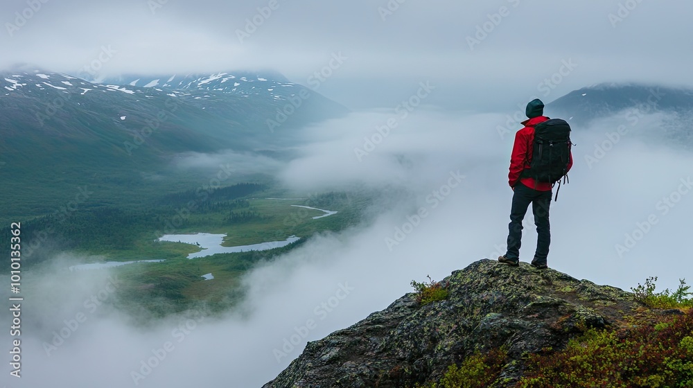 Hiker Enjoying Misty Mountain View in Nature Hiker Enjoying Misty Mountain View in Nature