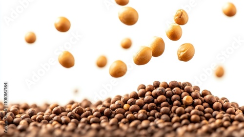 A close-up of brown and yellow seeds, some airborne, highlighting their texture and color.