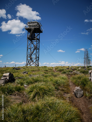 Portriat view of wooden lookout tower in Clearwater National Forest in Idaho in summer in North Clearwater Mountains photo