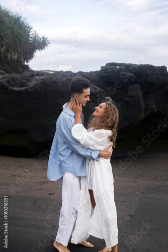 A Couple In Love, Husband And Wife, On The Beach Near The Ocean, Bali.