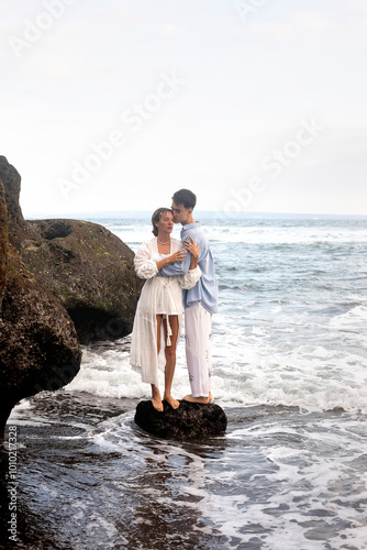 A couple in love, husband and wife, on the beach near the ocean, Bali.