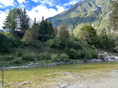 The Soča river near Bovac with its wooded shore (Bovec, Slovenia) - Der Fluss Soca bei Bovec mit einem bewaldeten Ufer (Bovec, Slowenien) - Reka Soča pri Bovcu z gozdnatim bregom (Bovec, Slovenija) photo