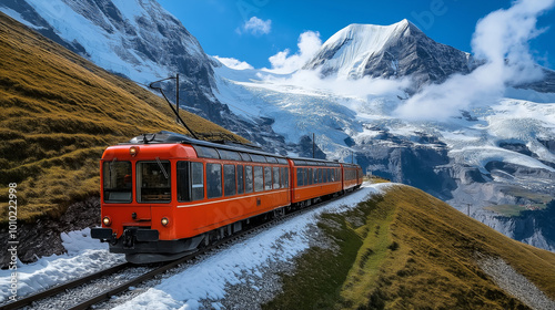 Red swiss train on a mountain pass is going to the jungfraujoch photo