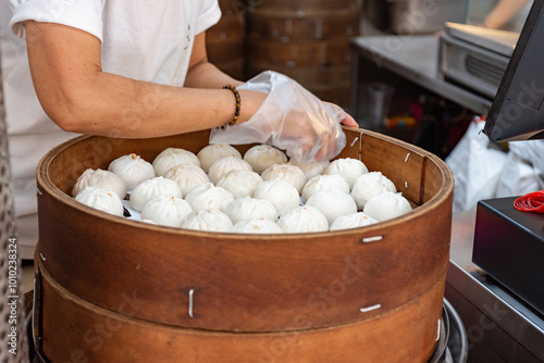 Canvas Print Large Tray Of Steamed Bread After Being Baked In A Store In Chinatown In Singapo