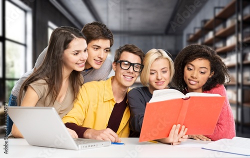 Group of teenage happy students study in classroom library