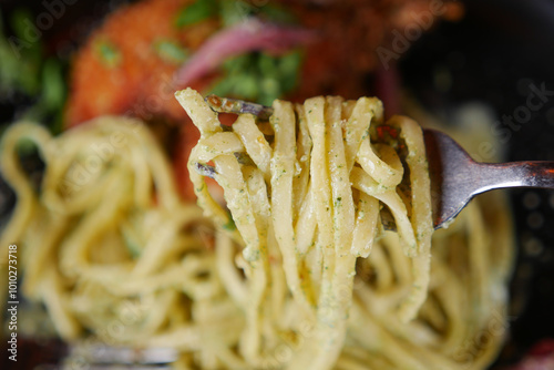  CloseUp of a Fork with Spaghetti in a Charming Italian Restaurant Setting photo