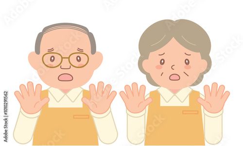 手のひらを向けて拒否するシニアスタッフ