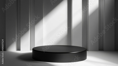 A black circular podium sits in a room with white walls and a subtle lighting effect from a window.