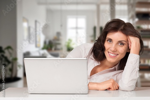 Happy smiling woman work on laptop computer