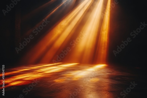 Golden rays of light streaming through a dark space  creating a dramatic and serene atmosphere on the floor