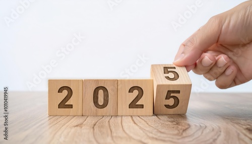 Fingers building new year 2025 with wooden ladder. Project, ideas and purposes for the month