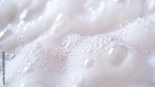 A luxurious white foam texture with bubbles captures the essence of shampoo, evoking freshness.